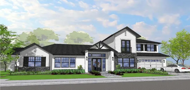 a front view of a house with a garden