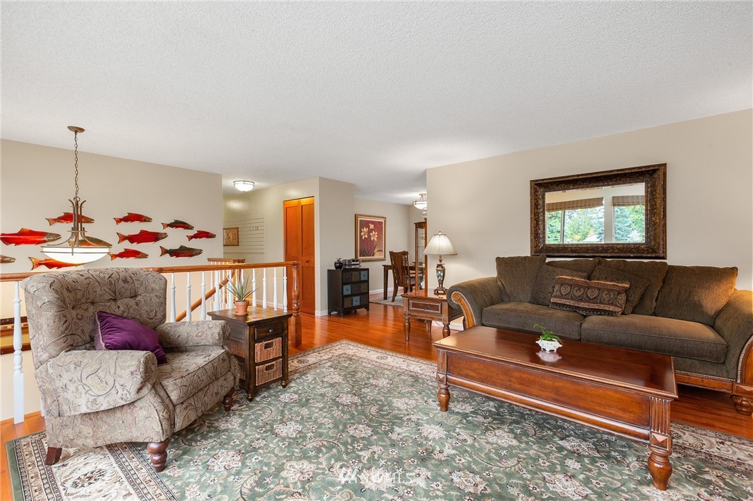 22230 5th Place West Bothell, WA 98021 - Photo 2 of 34 a living room with furniture and a wooden floor