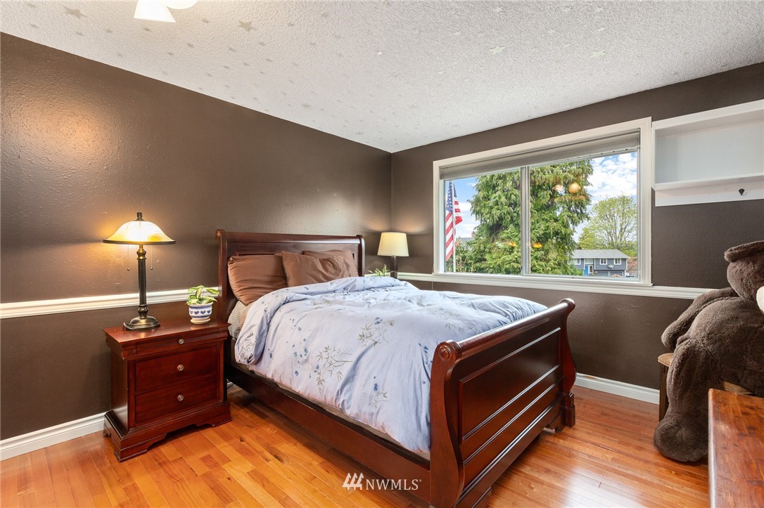22230 5th Place West Bothell, WA 98021 - Photo 12 of 34 a bed sitting in a bedroom next to a window
