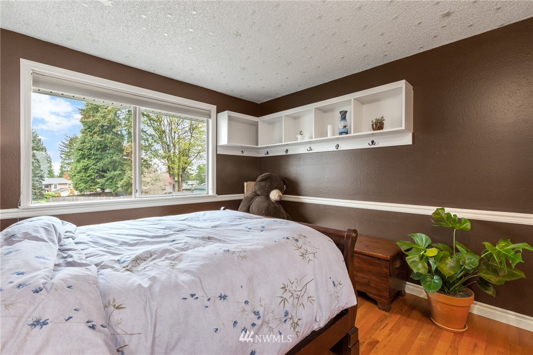 22230 5th Place West Bothell, WA 98021 - Photo 13 of 34 a bedroom with a bed and a window