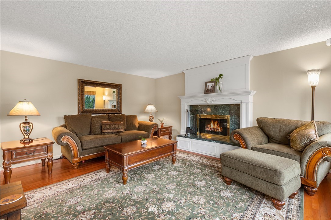 22230 5th Place West Bothell, WA 98021 - Photo 3 of 34 a living room with furniture and a fireplace