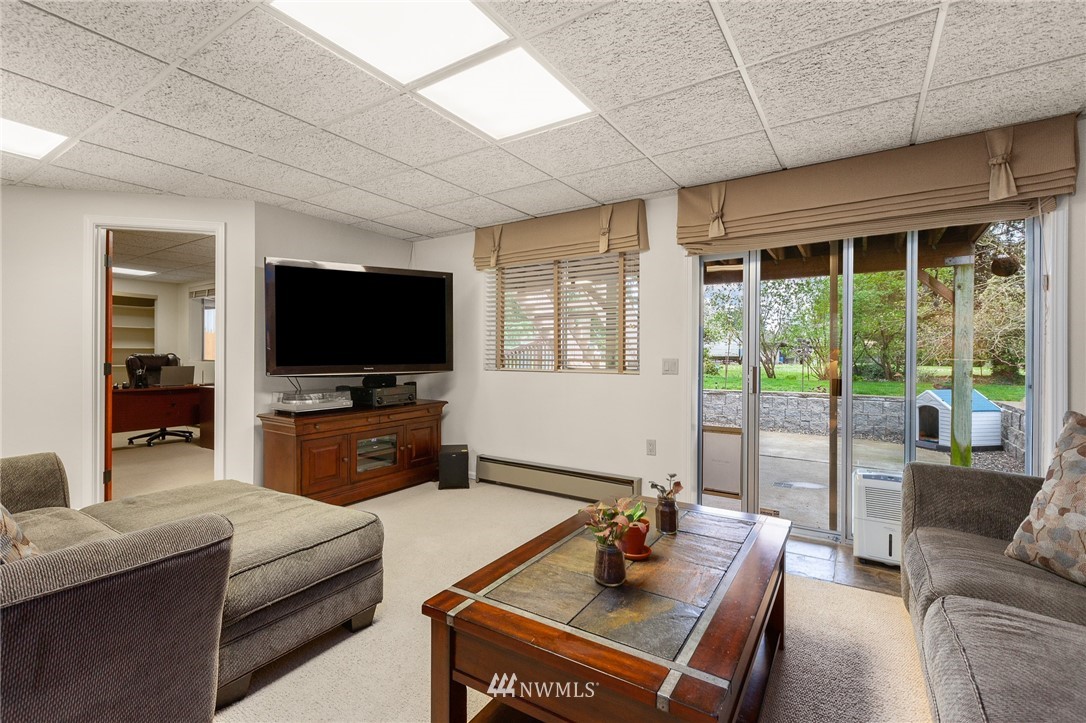 22230 5th Place West Bothell, WA 98021 - Photo 21 of 34 a living room with furniture and a flat screen tv