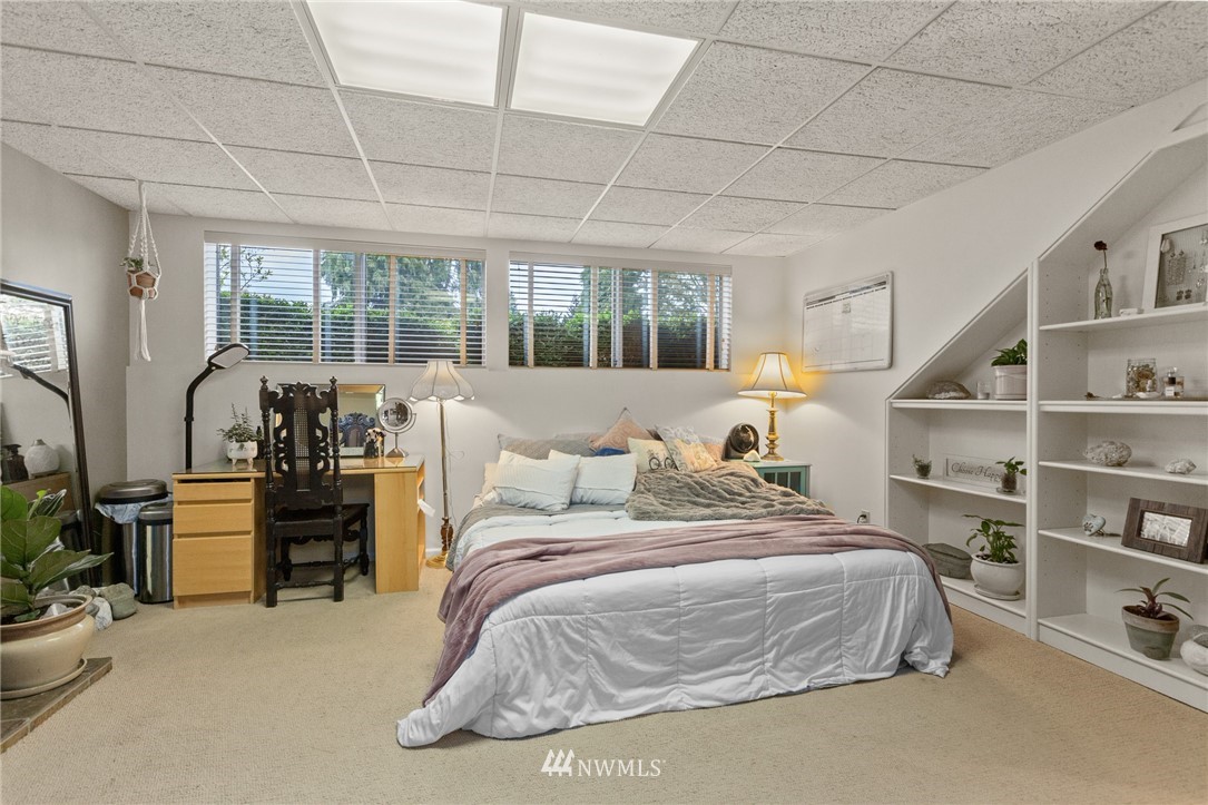 22230 5th Place West Bothell, WA 98021 - Photo 22 of 34 a bedroom with furniture and a large window