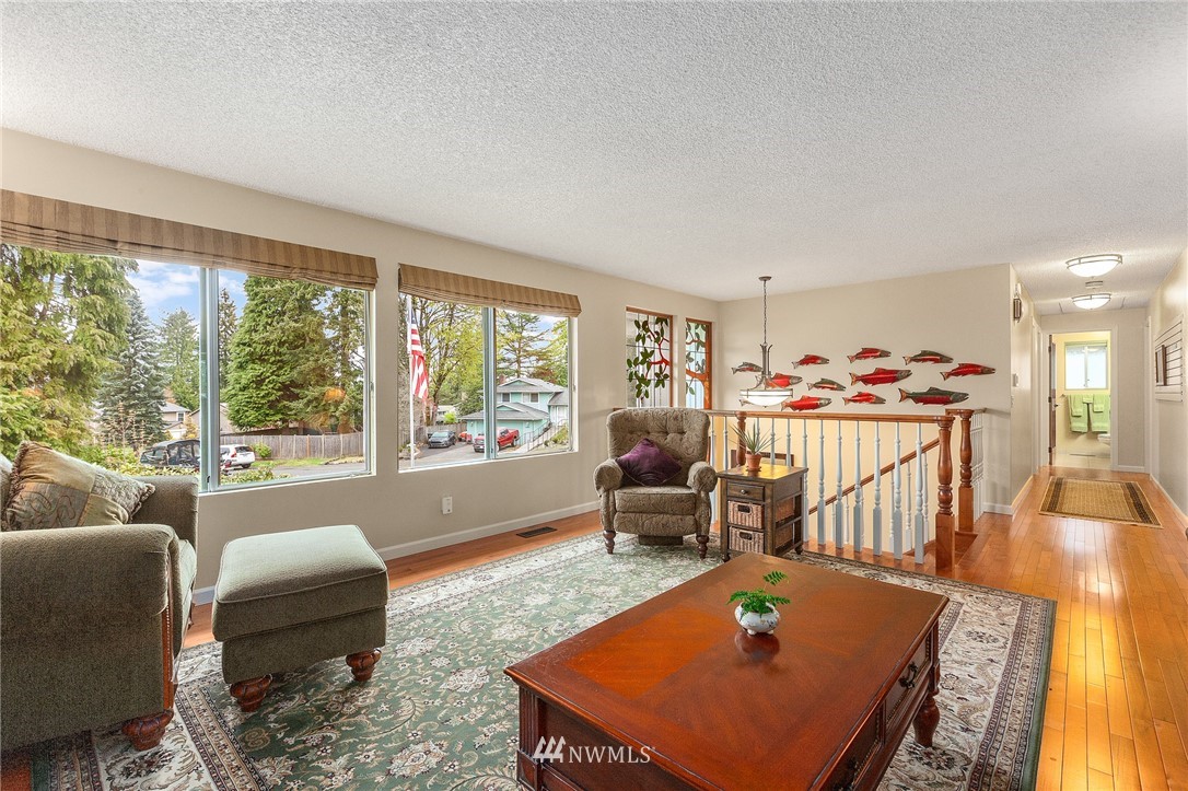 22230 5th Place West Bothell, WA 98021 - Photo 4 of 34 a living room with furniture a rug and a large window
