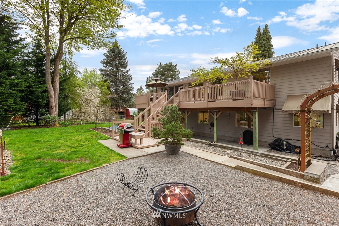 22230 5th Place West Bothell, WA 98021 - Photo 32 of 34 a view of a chair and fire pit in the backyard