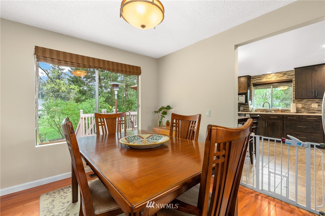 22230 5th Place West Bothell, WA 98021 - Photo 5 of 34 a view of a dining room with furniture and wooden floor