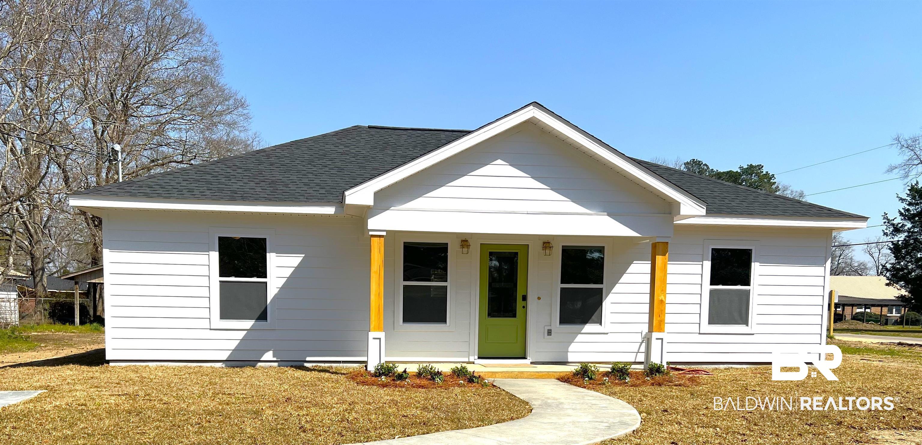 102 Earl Street Brewton, AL 36426 - Photo 1 of 27 View of front of house with a shingled roof, a porch, and a front yard