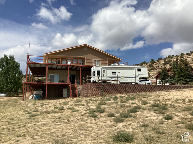 3 Red Circle, Unit 19 Manila, UT 84046 - Photo 6 of 29 Back of property featuring a deck and stairs