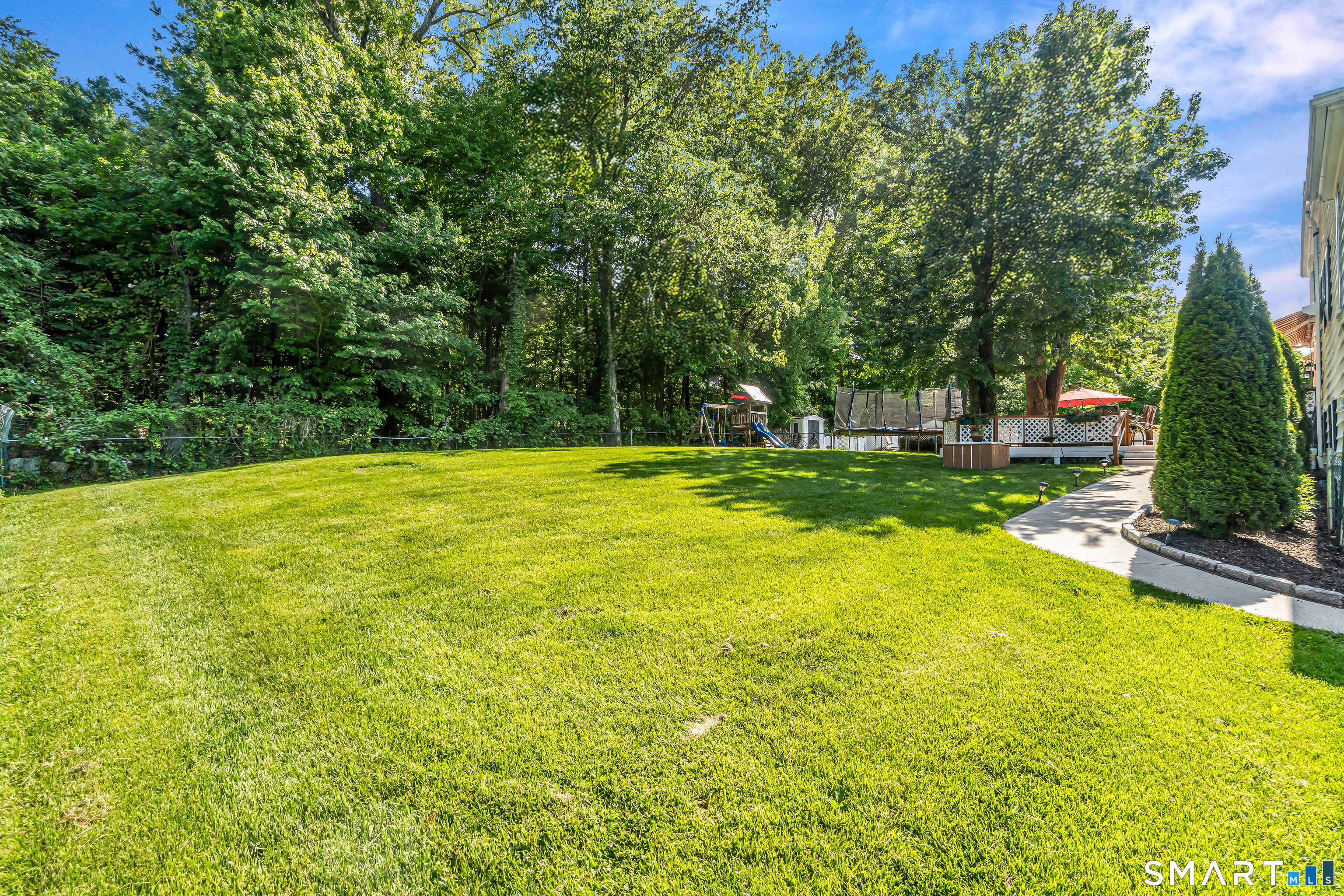 13 Pleasant Rise Circle Brookfield, CT 06804 - Photo 17 of 40 a view of a swimming pool with lawn chairs and plants