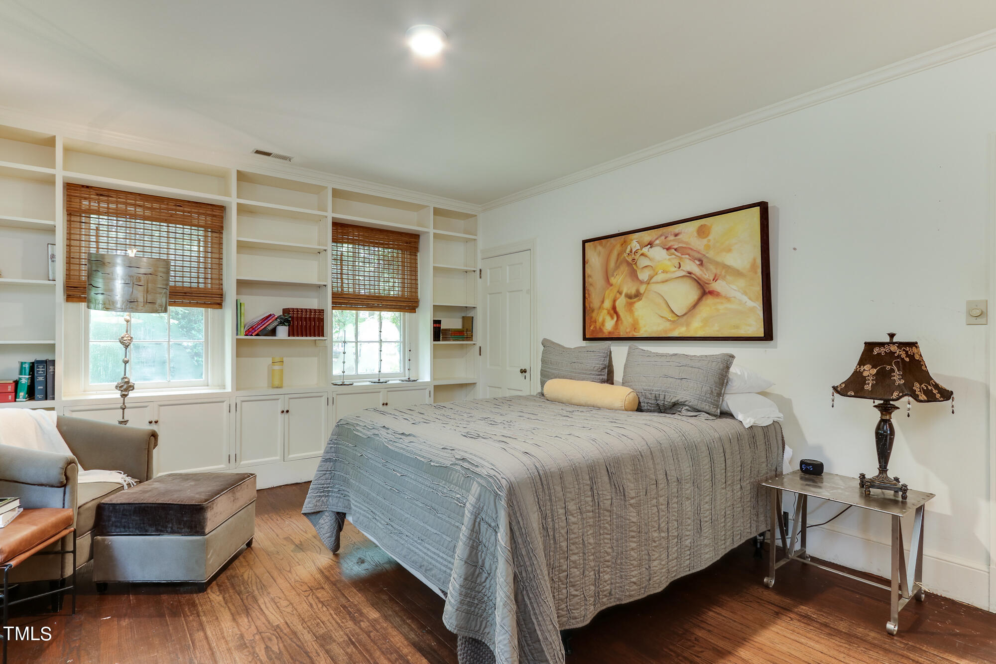 3231 Sussex Road Raleigh, NC 27607 - Photo 14 of 33 a bedroom with a bed wooden floor and window