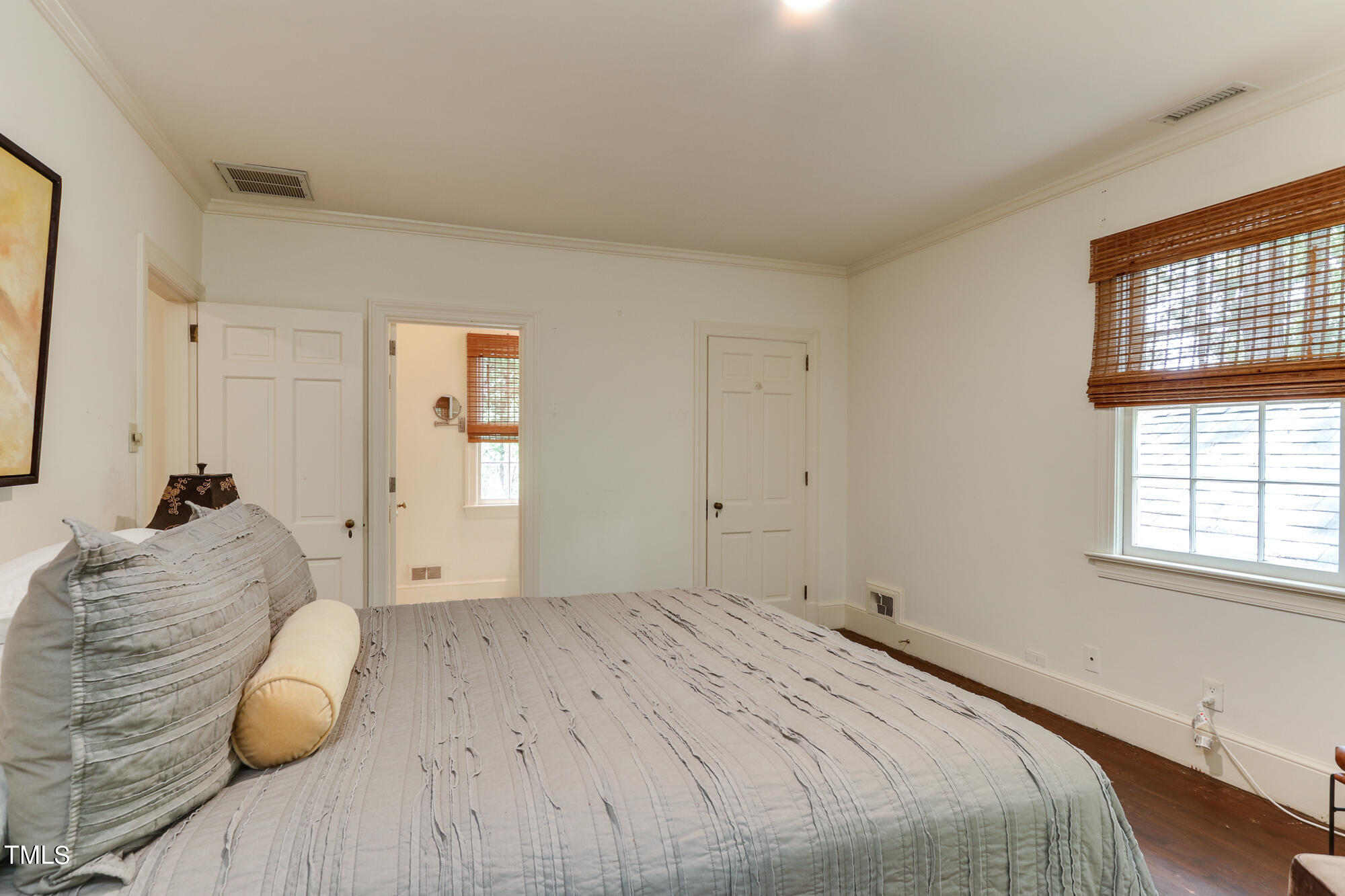 3231 Sussex Road Raleigh, NC 27607 - Photo 16 of 33 a bedroom with a bed and a window