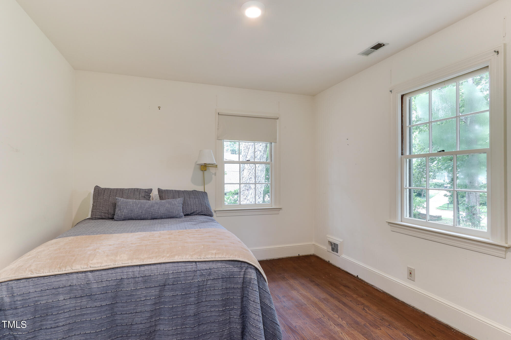3231 Sussex Road Raleigh, NC 27607 - Photo 18 of 33 a bedroom with a bed and window