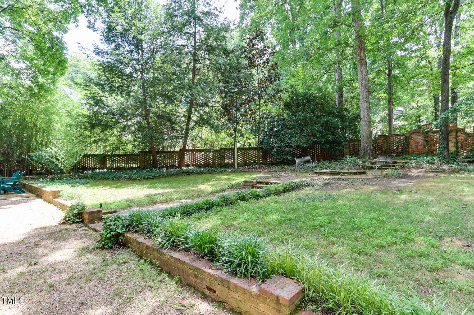 3231 Sussex Road Raleigh, NC 27607 - Photo 30 of 33 a backyard of a house with lots of green space