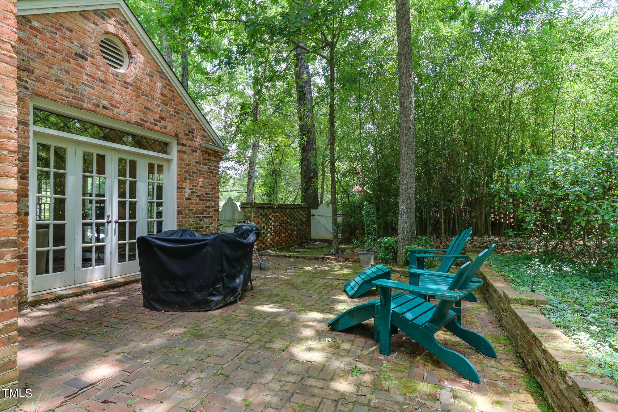 3231 Sussex Road Raleigh, NC 27607 - Photo 31 of 33 a view of a house with backyard sitting area and garden