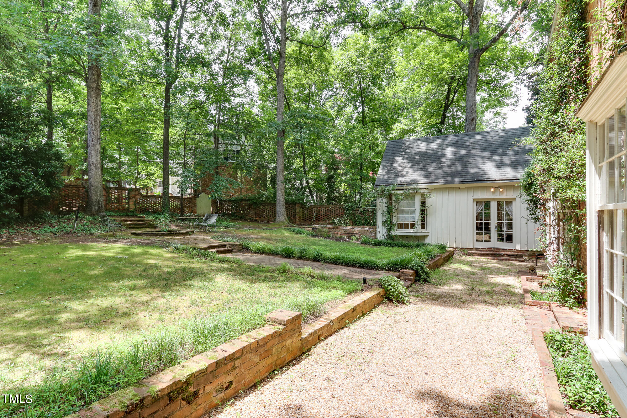 3231 Sussex Road Raleigh, NC 27607 - Photo 32 of 33 a view of backyard of house with green space