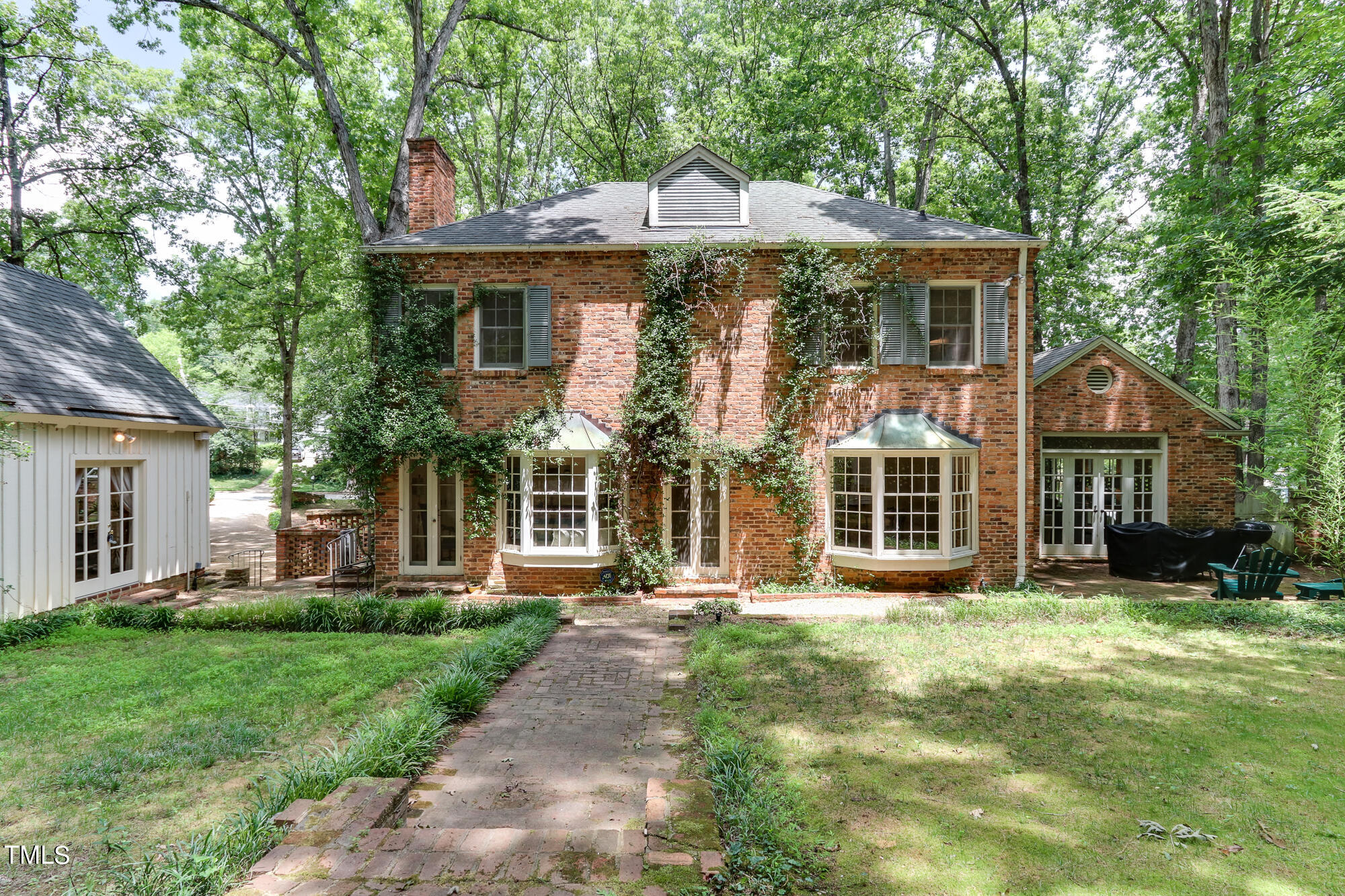 3231 Sussex Road Raleigh, NC 27607 - Photo 33 of 33 a front view of a house with a yard