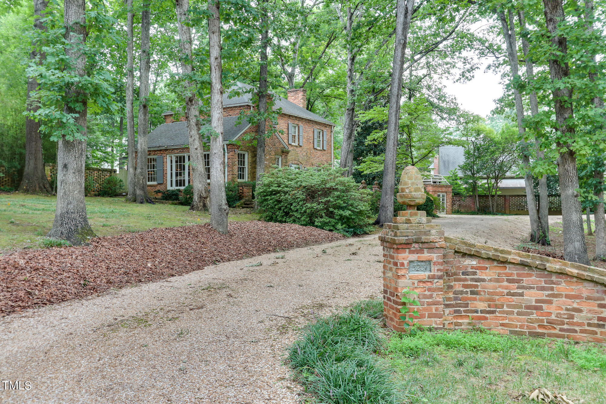 3231 Sussex Road Raleigh, NC 27607 - Photo 4 of 33 front view of a house with a yard