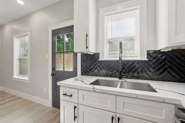 a kitchen with a sink and a window