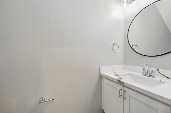 a bathroom with a sink and mirror