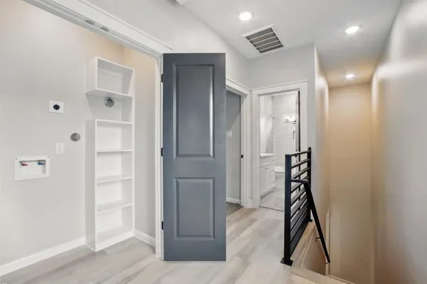 a bathroom with a shower and a glass door
