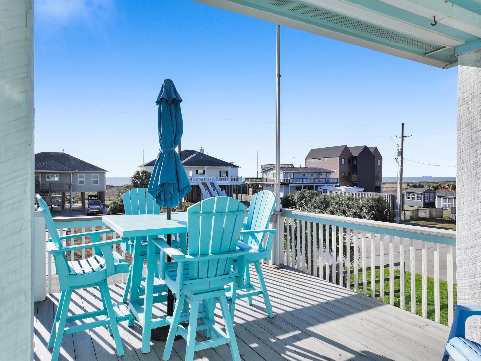353 Atkinson Street Crystal Beach, TX 77650 - Photo 12 of 42 a view of a chairs and table in the balcony