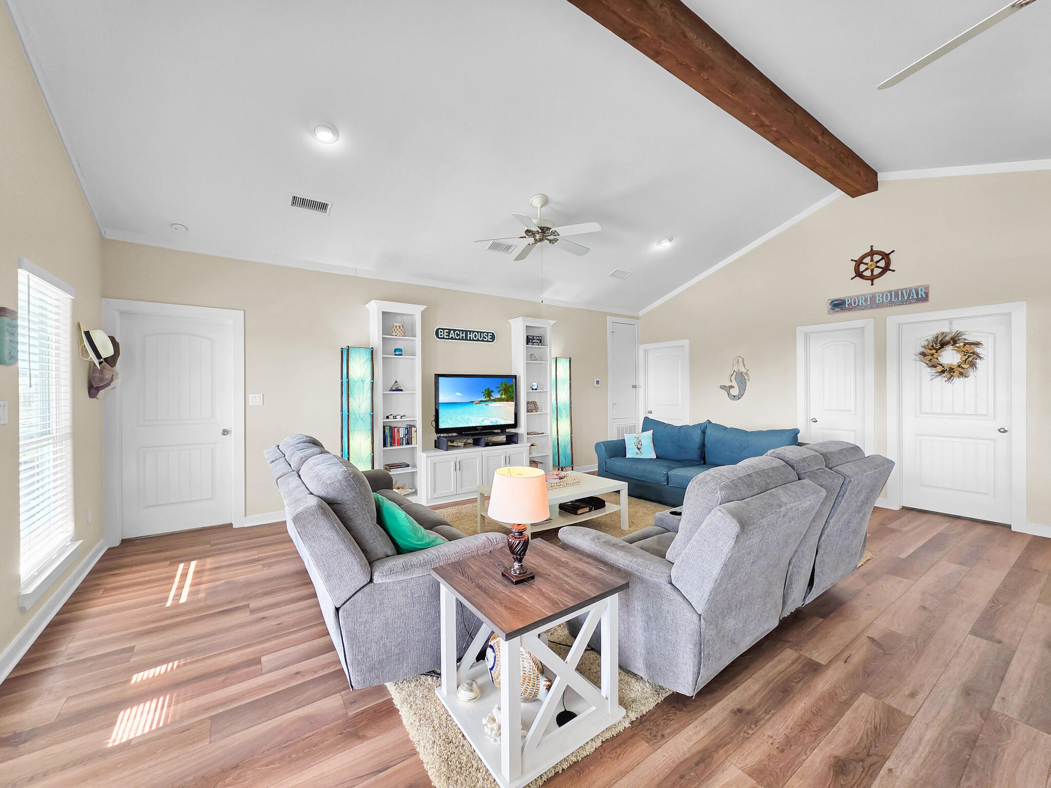 353 Atkinson Street Crystal Beach, TX 77650 - Photo 16 of 42 a living room with furniture and a wooden floor
