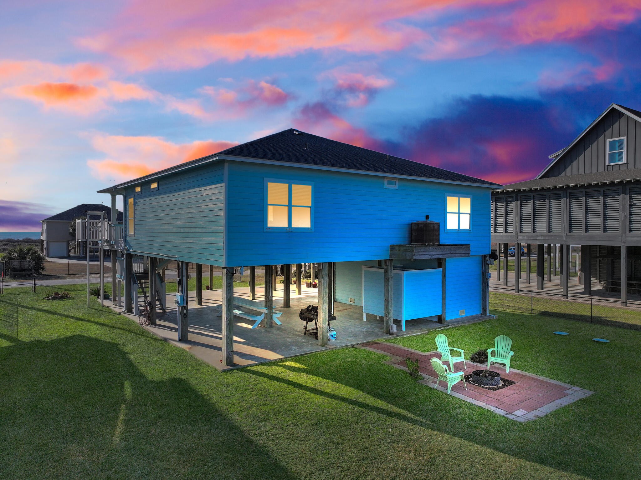 353 Atkinson Street Crystal Beach, TX 77650 - Photo 2 of 42 a front view of a house with a yard