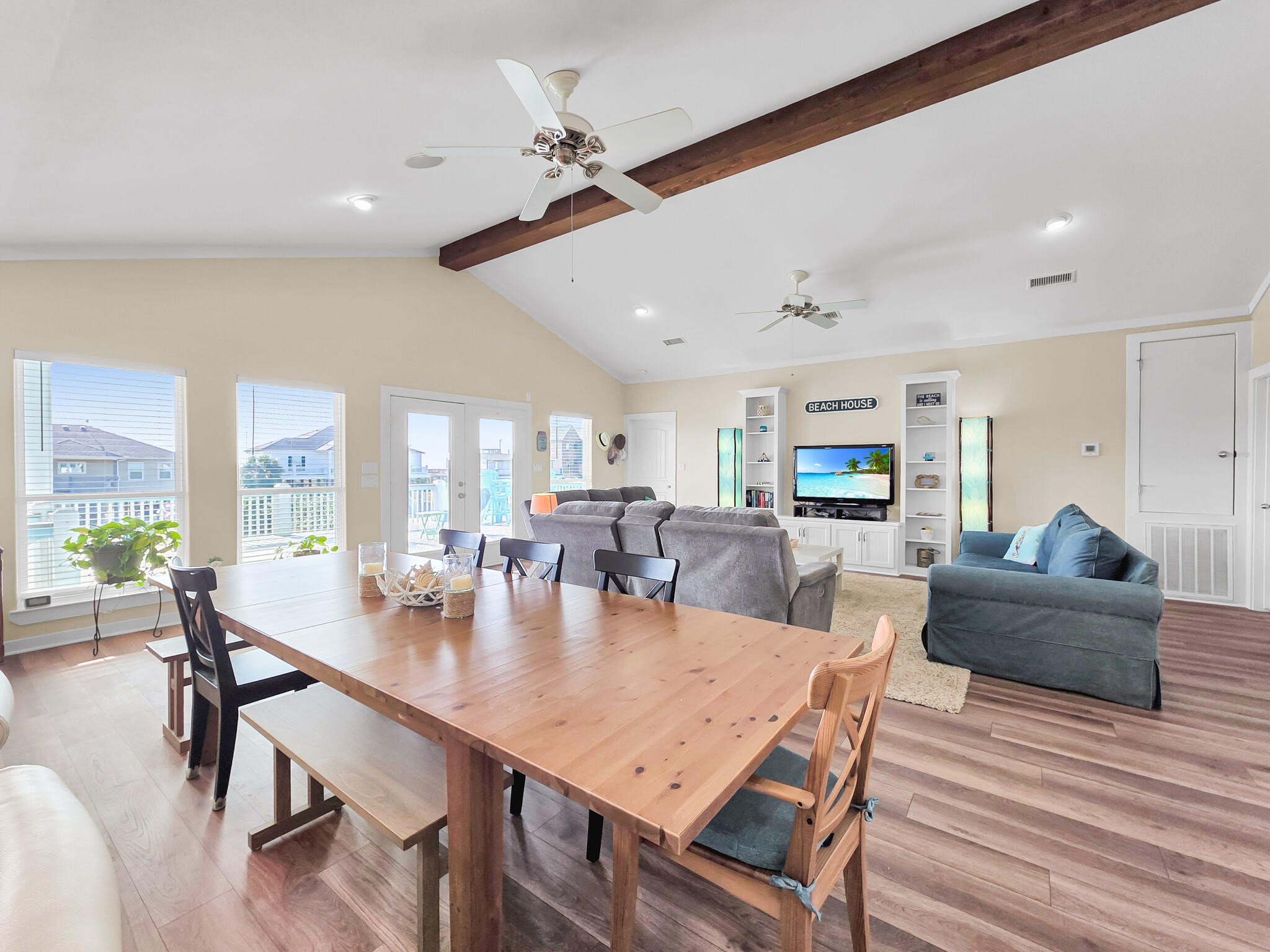 353 Atkinson Street Crystal Beach, TX 77650 - Photo 22 of 42 a view of a dining room with furniture window and wooden floor