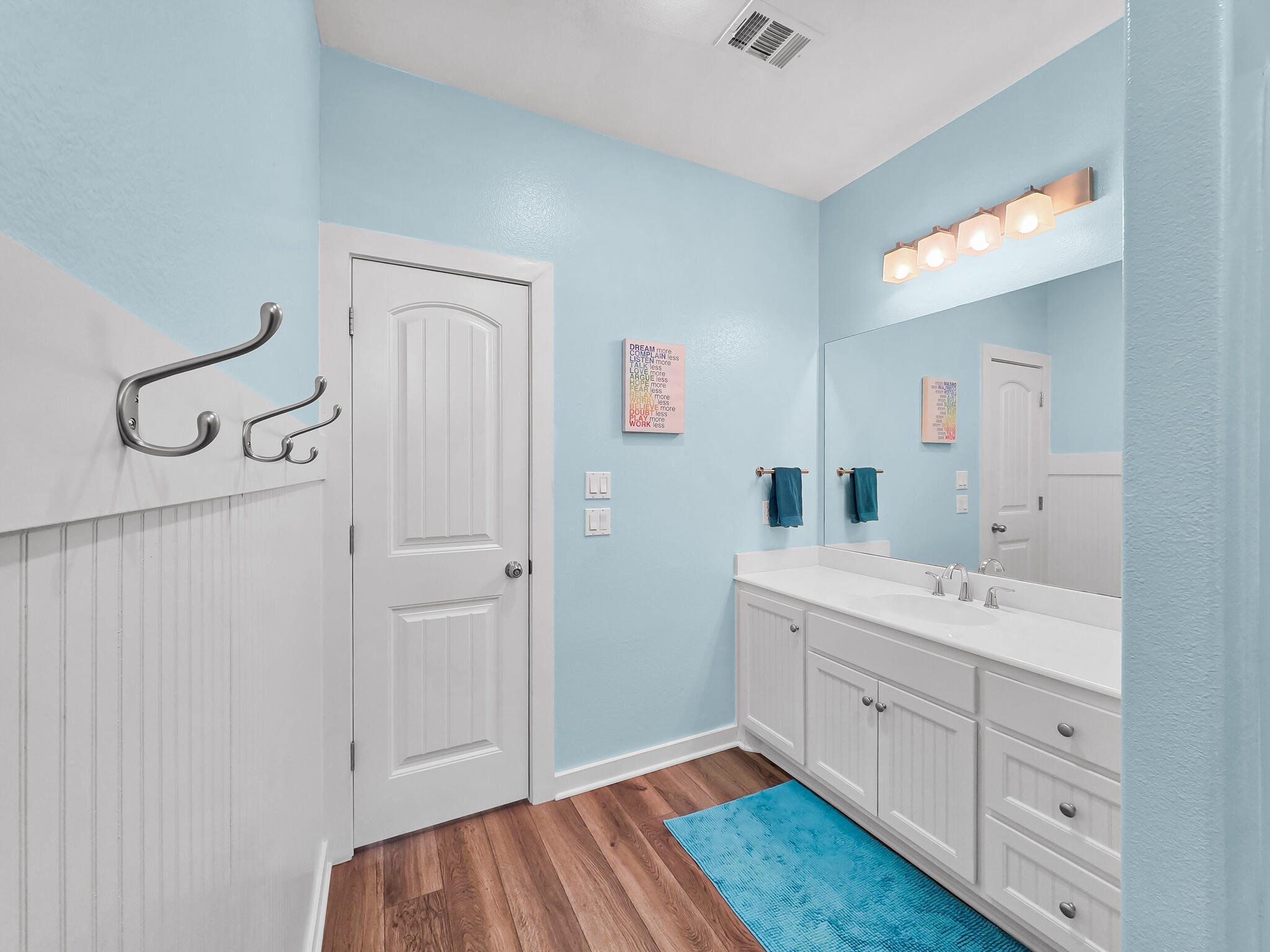 353 Atkinson Street Crystal Beach, TX 77650 - Photo 35 of 42 a bathroom with a sink and a mirror