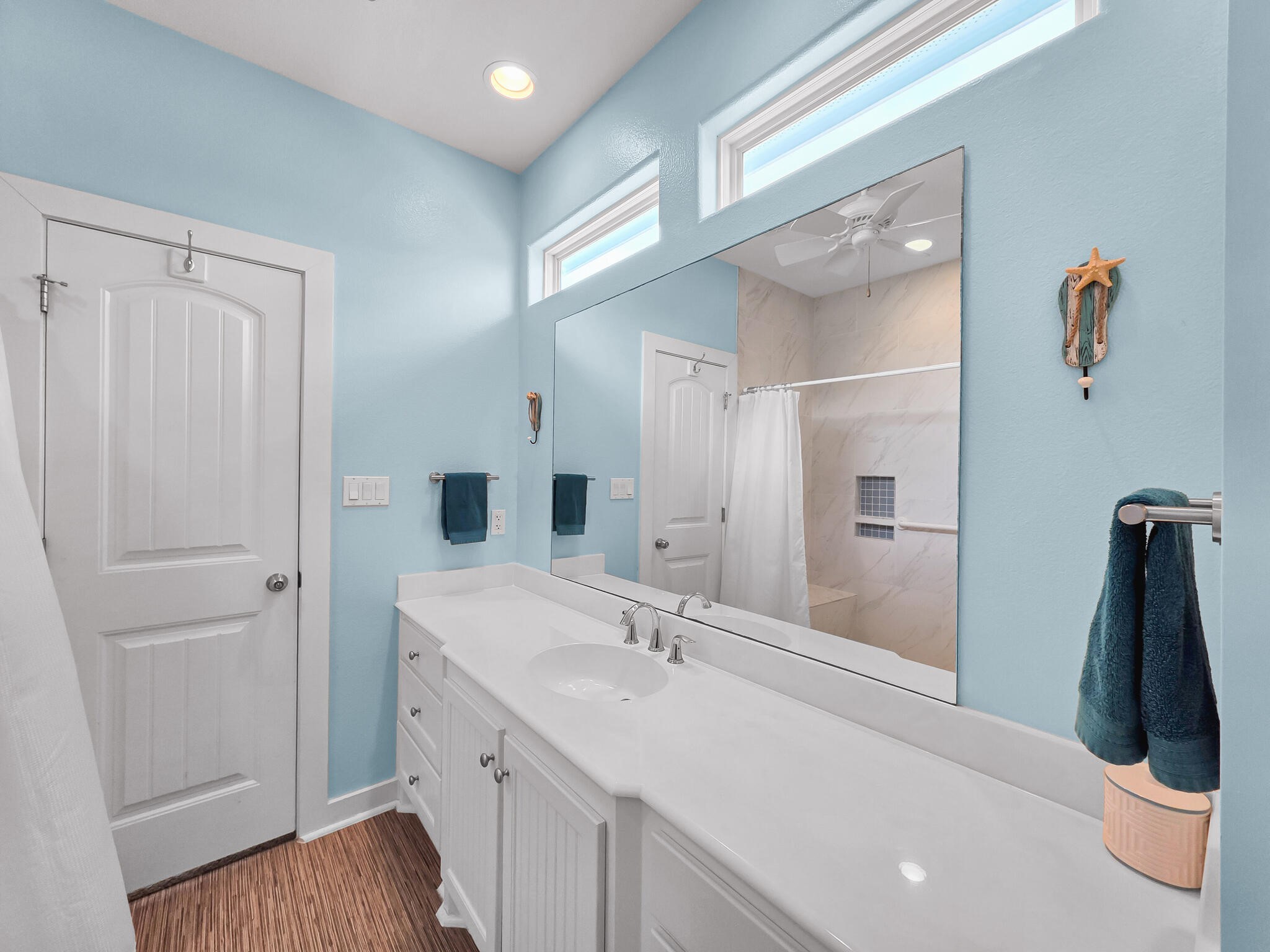 353 Atkinson Street Crystal Beach, TX 77650 - Photo 37 of 42 a bathroom with a sink a toilet and shower