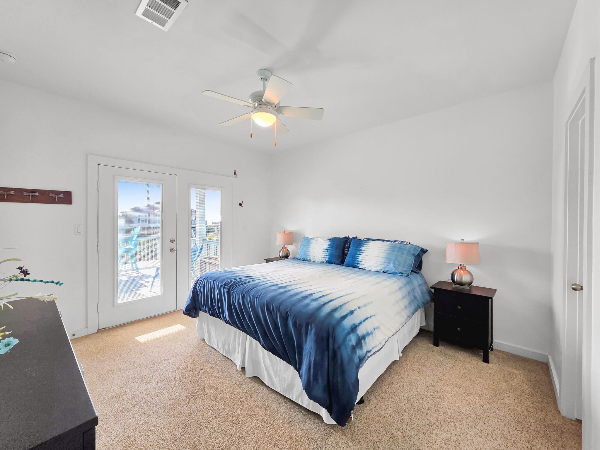 353 Atkinson Street Crystal Beach, TX 77650 - Photo 40 of 42 a spacious bedroom with a bed and window