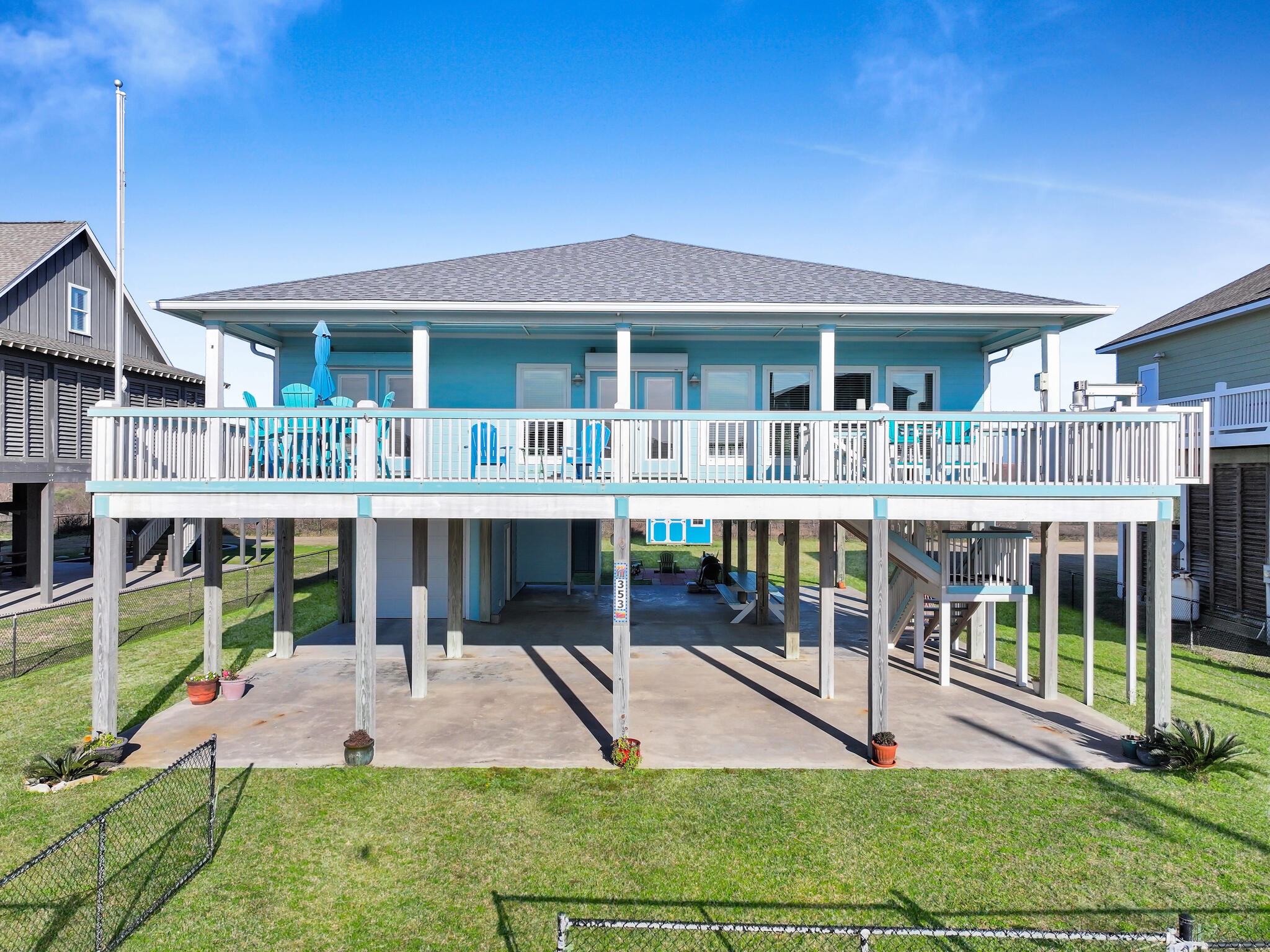 353 Atkinson Street Crystal Beach, TX 77650 - Photo 7 of 42 a view of a house with a yard patio and furniture