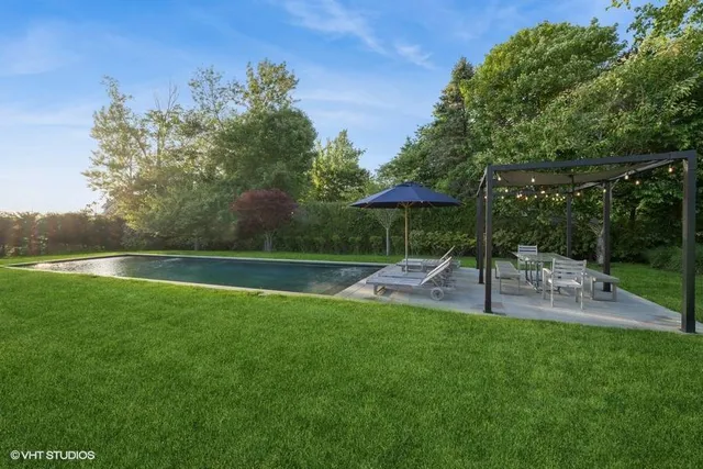 a view of a chair and table of the garden