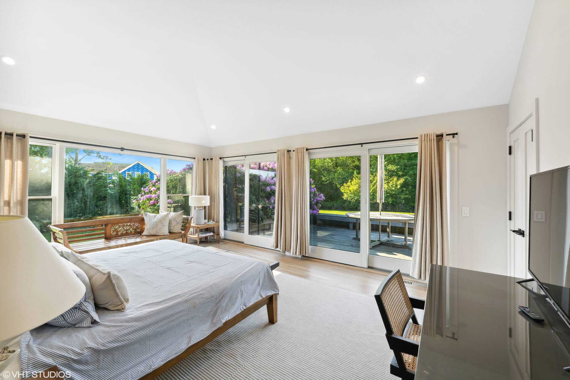 23 Winding Way Water Mill, NY 11976 - Photo 15 of 32 a bedroom with furniture and a large window