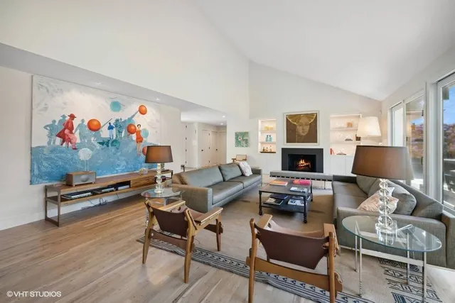 a living room with furniture a couch and a flat screen tv