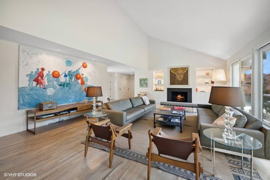 23 Winding Way Water Mill, NY 11976 - Photo 2 of 32 a living room with furniture a couch and a flat screen tv