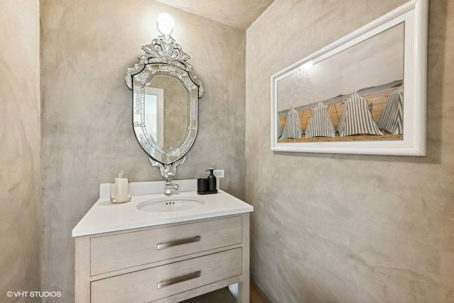 23 Winding Way Water Mill, NY 11976 - Photo 21 of 32 a bathroom with a sink mirror and vanity