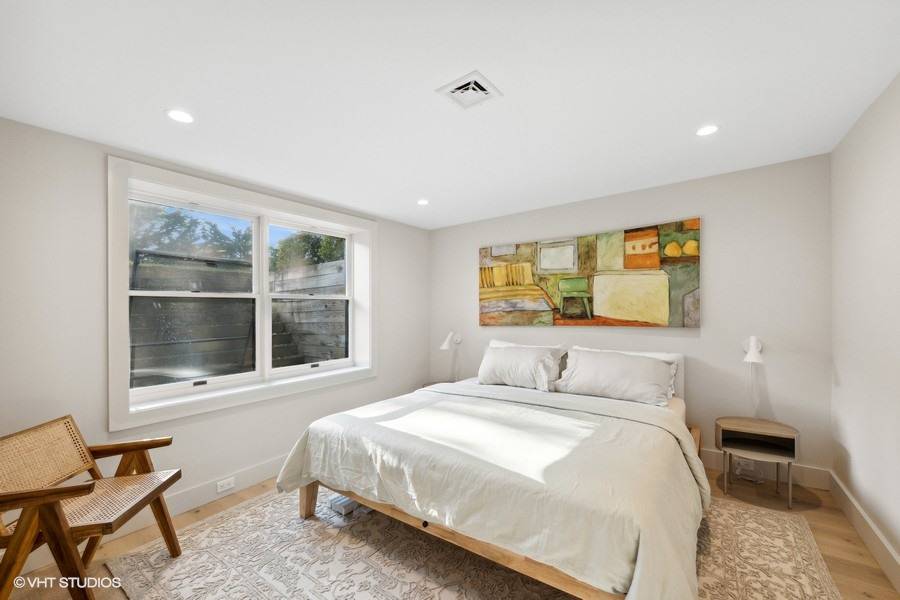 23 Winding Way Water Mill, NY 11976 - Photo 22 of 32 a bedroom with a bed and a window