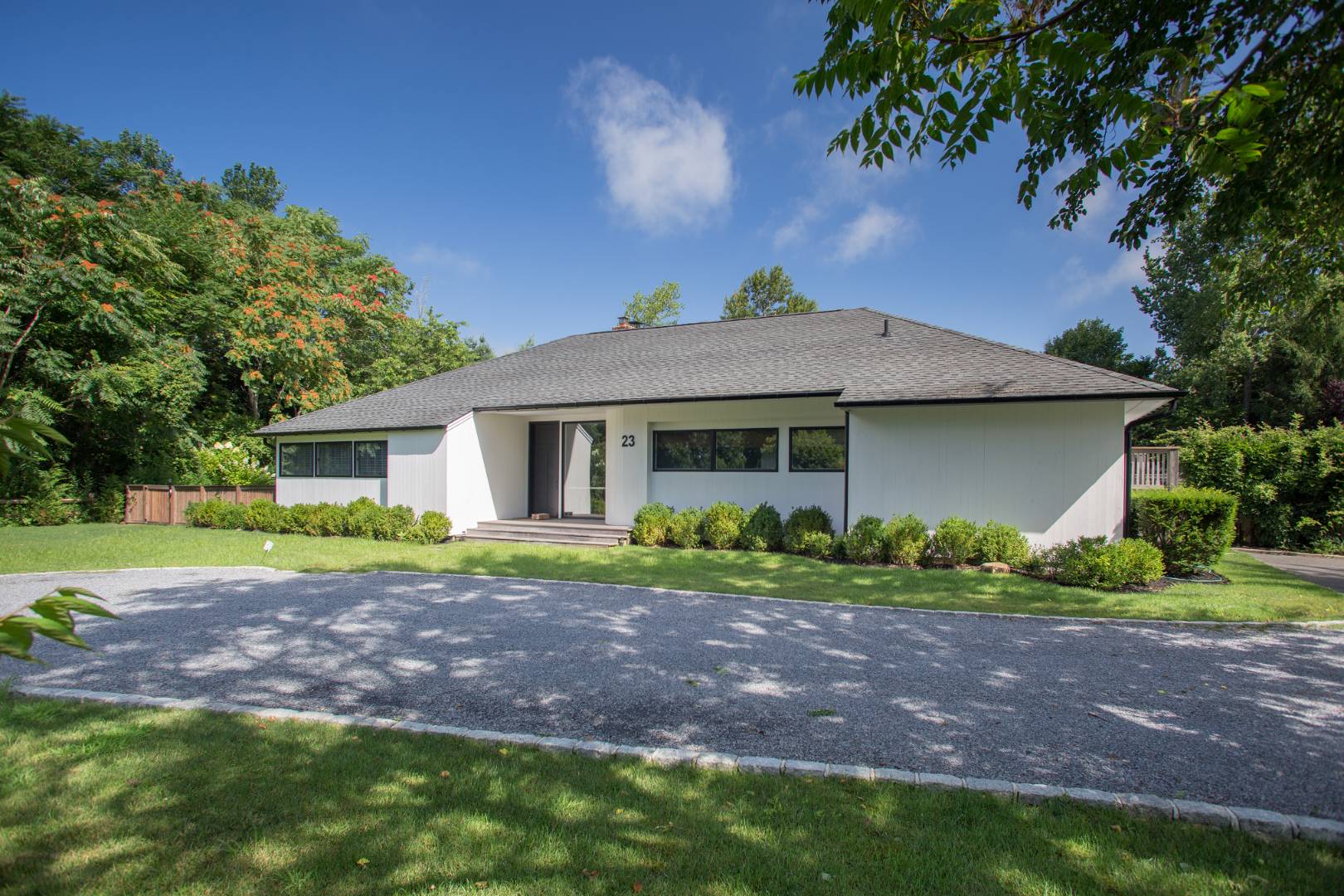 23 Winding Way Water Mill, NY 11976 - Photo 25 of 32 a view of a house with a yard and a garden