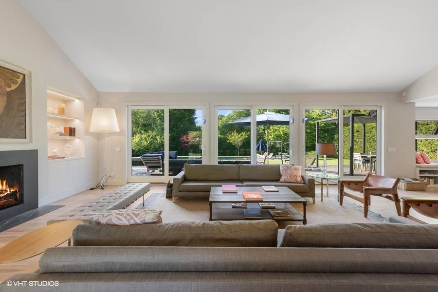 23 Winding Way Water Mill, NY 11976 - Photo 4 of 32 a living room with furniture and a large window