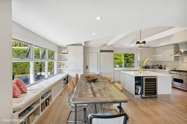 a kitchen with a stove a sink and a refrigerator