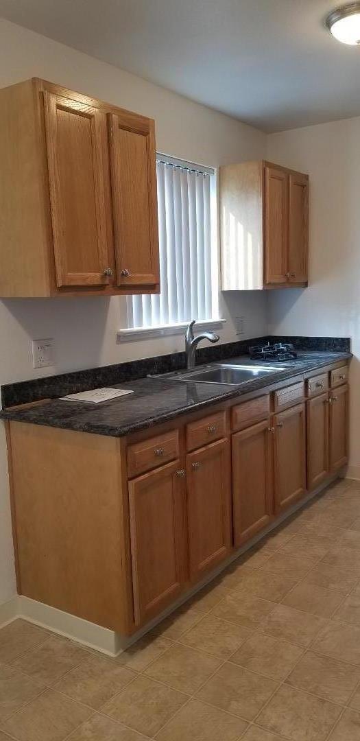 1110 Haddon Drive San Mateo, CA 94402 - Photo 14 of 18 a kitchen with stainless steel appliances granite countertop a sink stove and cabinets