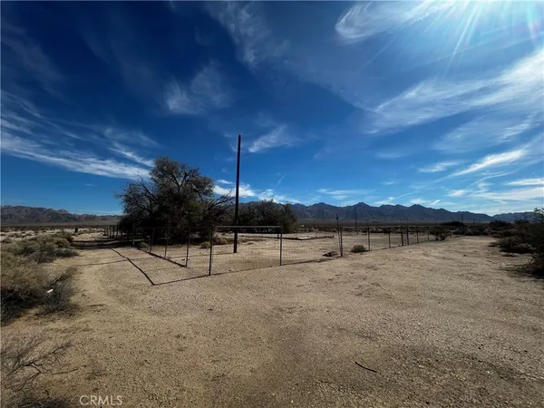 a view of a yard with an ocean view