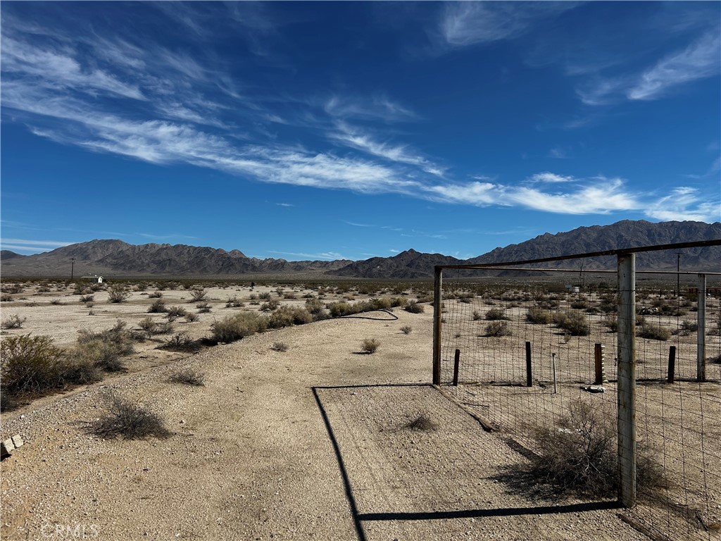 87780 Amboy Road Twentynine Palms, CA 92277 - Photo 20 of 23 a view of a yard with an ocean view