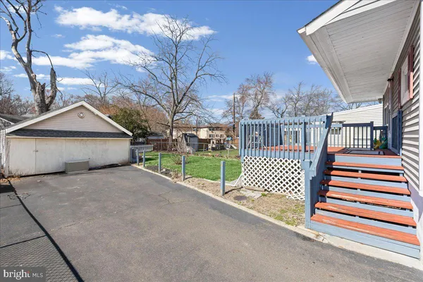 a view of a house with patio and a garden