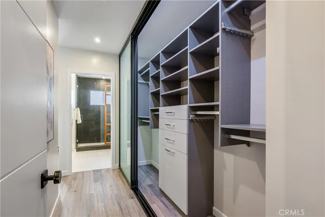 a spacious bedroom with a large bed and a window