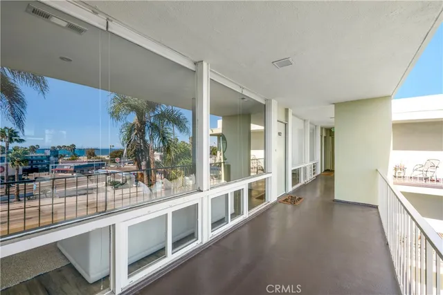 a view of a house with a palm tree
