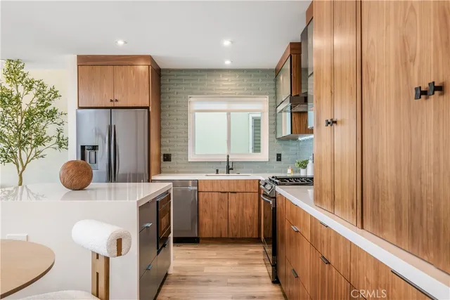 a kitchen with a table and chairs in it