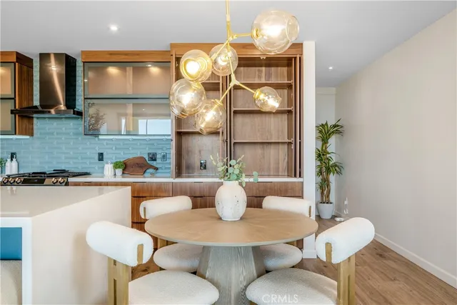 a bedroom with a large bed and a potted plant