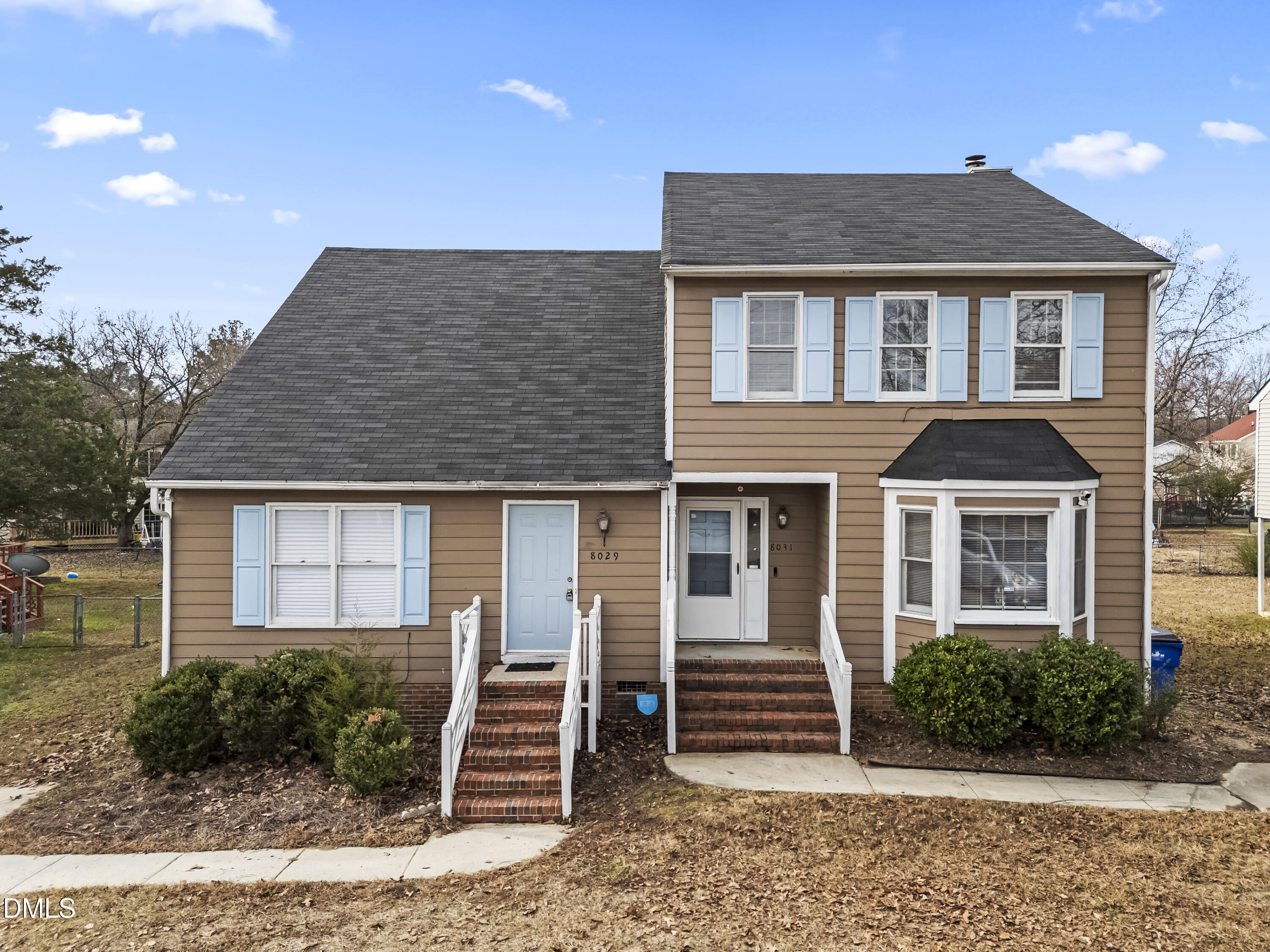 8031 Perry Creek Road Raleigh, NC 27616 - Photo 1 of 28 a front view of a house with a yard